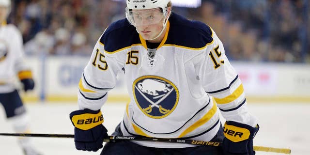 FILE - In this Nov. 10, 2015, file photo, Buffalo Sabres center Jack Eichel (15) gets ready for a faceoff against the Tampa Bay Lightning during the third period of an NHL hockey game in Tampa, Fla. Eichel was helped off the ice after hurting his left leg during practice on Wednesday, Oct. 12, 2016. he was in front of the net when he got tangled up with a defensemen and his leg buckled beneath him. The injury occurred a day before the Sabres open the season hosting the Montreal Canadiens. (AP Photo/Chris O'Meara, File)
