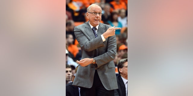 Syracuse head coach Jim Boeheim gestures to his players during the second half against Providence in an NCAA college basketball game in Syracuse, N.Y., Wednesday, Feb. 20, 2013. Syracuse won 84-59. (AP Photo/Kevin Rivoli)