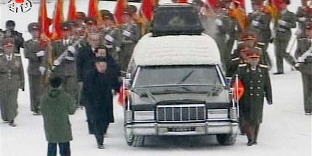 Dec. 28, 2011: In this image made from KRT television, a hearse is driven during a funeral procession of North Korean leader Kim Jong Il in the snow in Pyongyang.