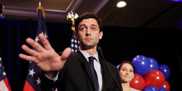 Democratic candidate for 6th congressional district Jon Ossoff, left, concedes to Republican Karen Handel while joined by his fiancee Alisha Kramer at his election night party in Atlanta, Tuesday, June 20, 2017. (AP Photo/David Goldman)