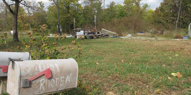 In this Tuesday, Oct. 18, 2016 photo, a porch is all that remains of the home on Union Hill Road after investigators removed the trailer where the bodies of Clarence "Frankie" Rhoden and Hannah Gilley were found on April 22, two of eight family members found shot to death that day in Piketon, Ohio.