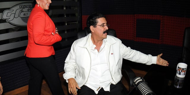 Free Party Presidential candidate Xiomara Castro, left, and her husband, ousted President Manuel Zelaya, arrive for an radio interview in Tegucigalpa, Honduras, Wednesday Nov. 27, 2013. Castro spoke about last Sunday's election results which declared ruling party candidate Juan Orlando Hernandez the winner, saying that there was fraud in the elections and that she will present the evidence Friday. (AP Photo/Fernando Antonio)