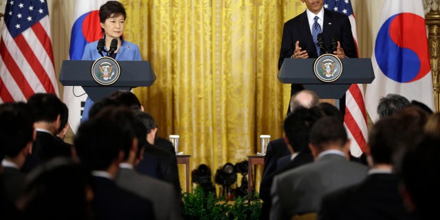 President Barack Obama and South Korea President Park Geun-Hye answer questions during a news conference in the East Room of the White House in Washington, Tuesday, May 7, 2013. (AP Photo/Pablo Martinez Monsivais)