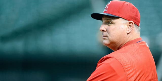 BALTIMORE, MD - MAY 16: Manager Mike Scioscia #14 of the Los Angeles Angels watches batting practice before the game against the Baltimore Orioles at Oriole Park at Camden Yards on May 16, 2015 in Baltimore, Maryland. (Photo by G Fiume/Getty Images)