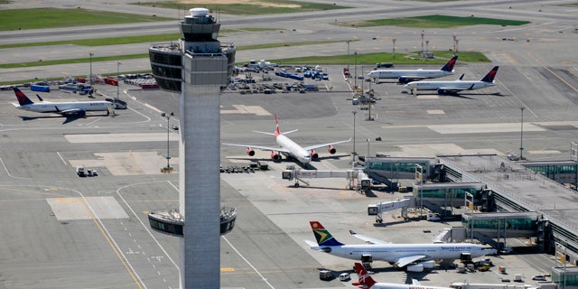 FILE: April 2010:  The air traffic control tower and terminals at John F. Kennedy International Airport in New York.