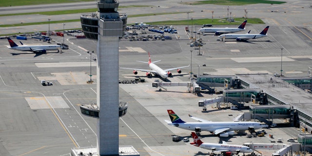 FILE: April 2010: The air traffic control tower and terminals at John F. Kennedy International Airport in New York.