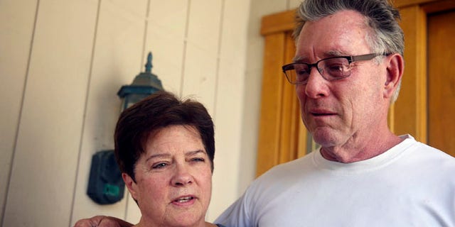 July 2, 2015: Liz Sullivan, left, and Jim Steinle, right, parents of Kathryn "Kate" Steinle, talk to members of the media outside their home in Pleasanton, Calif.