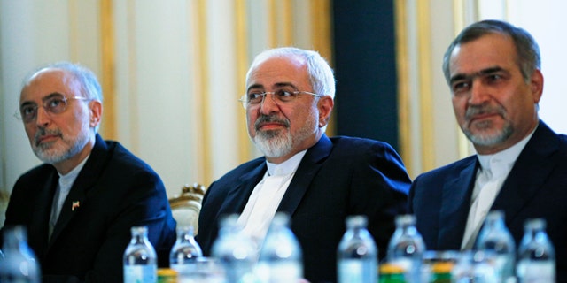 July 3, 2015: Iranian Foreign Minister Mohammad Javad Zarif, centre, Head of the Iranian Atomic Energy Organization Ali Akbar Salehi, left, and Hossein Fereydoon, brother and close aide to President Hassan Rouhani, meet with U.S. Secretary of State John Kerry in Vienna, Austria.