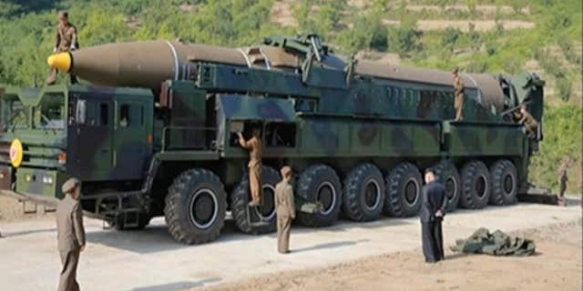 This image made from video of a news bulletin aired by North Korea's KRT on Tuesday, July 4, 2017, shows what was said to be the preparation of the launch of a Hwasong-14 intercontinental ballistic missile, ICBM, in North Korea's northwest.