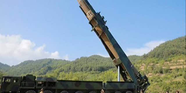 This image made from video of a news bulletin aired by North Korea's KRT on Tuesday, July 4, 2017, shows what was said to be the preparation of the launch of a Hwasong-14 intercontinental ballistic missile, ICBM, in North Korea's northwest.
