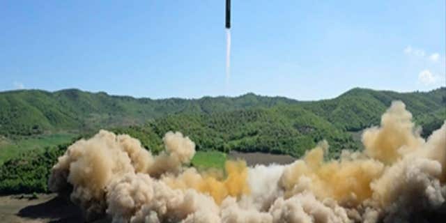 This image made from video of a news bulletin aired by North Korea's KRT on Tuesday, July 4, 2017, shows what was said to be the launch of a Hwasong-14 intercontinental ballistic missile, ICBM, in North Korea's northwest.