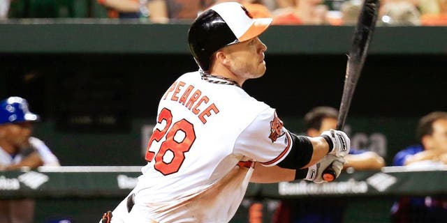 BALTIMORE, MD - JULY 03: Steve Pearce #28 of the Baltimore Orioles follows his RBI double against the Texas Rangers in the fifth inning at Oriole Park at Camden Yards on July 3, 2014 in Baltimore, Maryland. (Photo by Rob Carr/Getty Images)