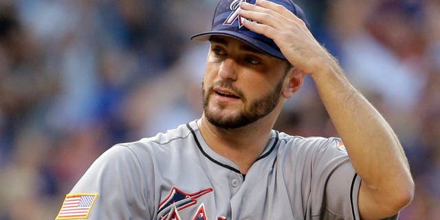 Miami Marlins starter Jarred Cosart reacts after Chicago Cubs' Kris Bryant hit a grand slam during the second inning of a baseball game Saturday, July 4, 2015, in Chicago. (AP Photo/Nam Y. Huh)