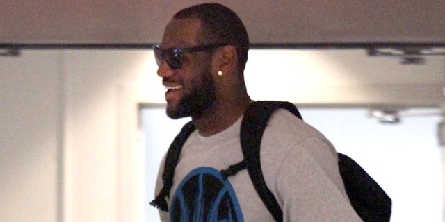 July 2: Free agent basketball player LeBron James makes his way through the IMG building to talk with the Miami Heat in Cleveland.