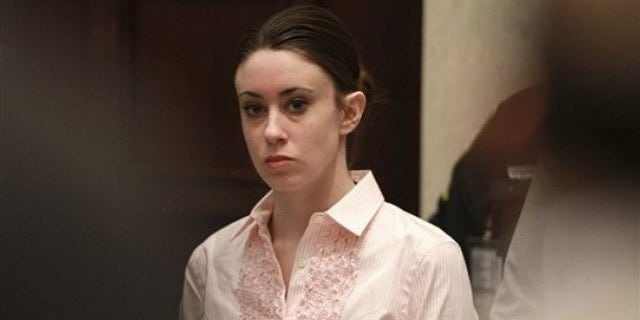 July 5: Casey Anthony stands for the arrival of the jury at the start of the second day of jury deliberations in her murder trial at the Orange County Courthouse in Orlando, Fla.