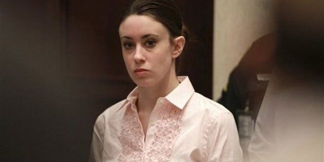 July 5: Casey Anthony stands for the arrival of the jury at the start of the second day of jury deliberations in her murder trial at the Orange County Courthouse in Orlando, Fla.