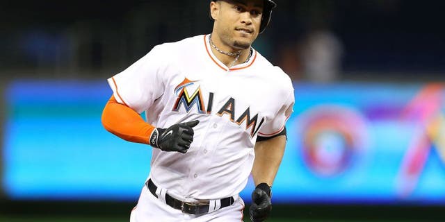 The Miami Marlins' Giancarlo Stanton rounds third after hitting a solo home run in the second inning against the St. Louis Cardinals on Wednesday, June 24, 2015, at Marlins Park in Miami. The Cards won, 6-1. (David Santiago/El Nuevo Herald/TNS via Getty Images)