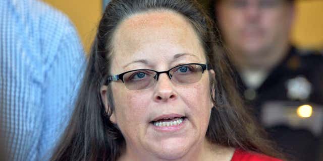 FILE - In this Sept. 14, 2015, file photo, Rowan County Clerk Kim Davis makes a statement to the media at the front door of the Rowan County Judicial Center in Morehead, Ky.