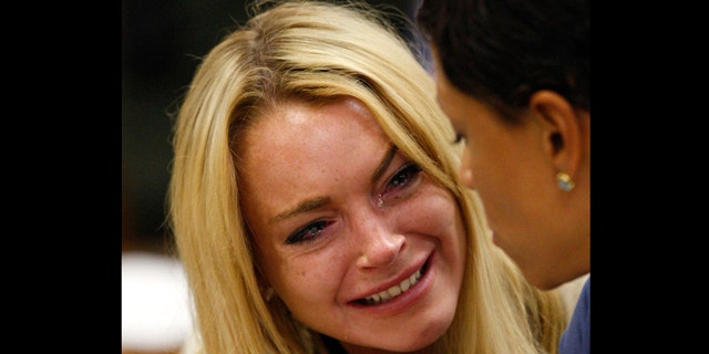 July 6: Actress Lindsay Lohan reacts after the sentencing by Superior Court Judge Marsha Reve during a hearing in Beverly Hills, Calif.