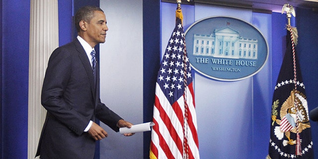 July 5: Obama arrives in the James Brady Press Briefing Room of the White House in Washington to make a statement to reporters about debt ceiling negotiations.