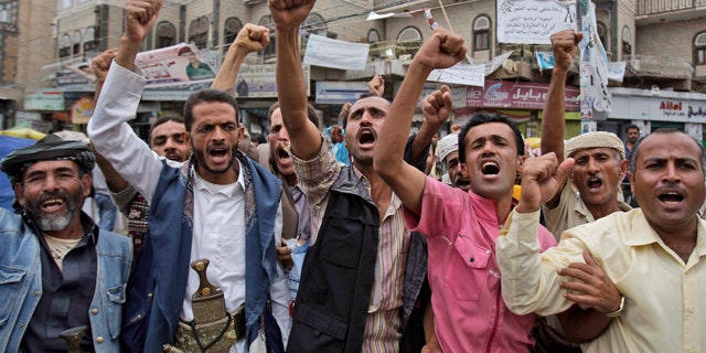 July 5: Anti-government protestors shout slogans during a demonstration demanding the resignation of Yemeni President Ali Abdullah Saleh in Sanaa, Yemen.