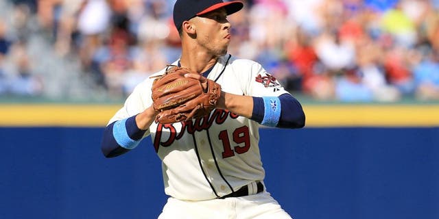 ATLANTA, GA - JUNE 21: Andrelton Simmons #19 of the Atlanta Braves fields a ball during the game against the New York Mets at Turner Field on June 21, 2015 in Atlanta, Georgia. (Photo by Daniel Shirey/Getty Images)