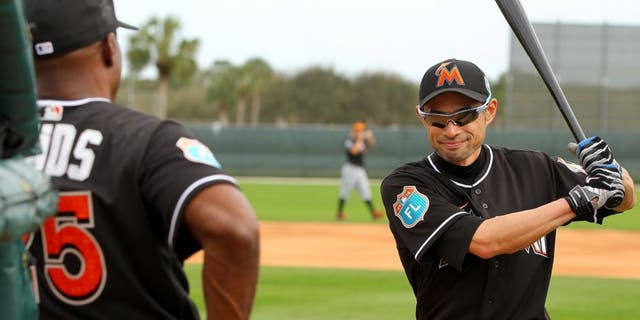 JUPITER, FL - FEBRUARY 23: Ichiro Suzuki #51 talks with new Marlins hitting coach Barry Bonds #25 during a Miami Marlins workout on February 23, 2016 in Jupiter, Florida. (Photo by Rob Foldy/Getty Images)