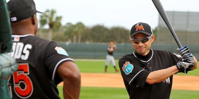 JUPITER, FL - FEBRUARY 23: Ichiro Suzuki #51 talks with new Marlins hitting coach Barry Bonds #25 during a Miami Marlins workout on February 23, 2016 in Jupiter, Florida. (Photo by Rob Foldy/Getty Images)