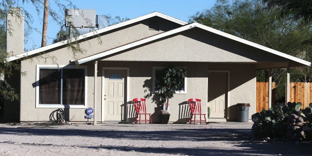 This Tuesday, Nov. 26, 2013 photo shows the home where three girls were allegedly imprisoned by their mother and stepfather, in Tucson, Ariz. Tucson Police Capt. Michael Gillooly said Tuesday at a news conference that all three girls were malnourished and dirty, and they told officers they hadn't taken a bath in up to six months. The couple made their initial court appearances Wednesday. (AP Photo/Arizona Daily Star, Mike Christy) ALL LOCAL TV OUT; PAC-12 OUT; MANDATORY CREDIT