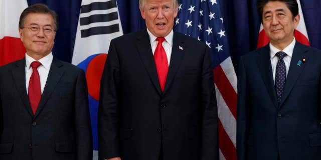 President Donald Trump meets with Japanese Prime Minister Shinzo Abe, right, and South Korean President Moon Jae-in before the Northeast Asia Security dinner at the US Consulate General Hamburg, Thursday, July 6, 2017, in Hamburg.