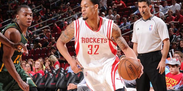 HOUSTON, TX - APRIL 15: K.J. McDaniels #32 of the Houston Rockets handles the ball against the Utah Jazz on April 15, 2015 at the Toyota Center in Houston, Texas. NOTE TO USER: User expressly acknowledges and agrees that, by downloading and or using this photograph, User is consenting to the terms and conditions of the Getty Images License Agreement. Mandatory Copyright Notice: Copyright 2015 NBAE (Photo by Bill Baptist/NBAE via Getty Images)