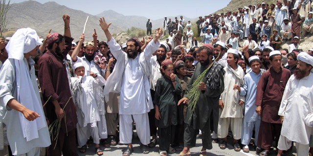 July 7: Afghans shout anti-U.S. slogans during a demonstration in Khost, Afghanistan.