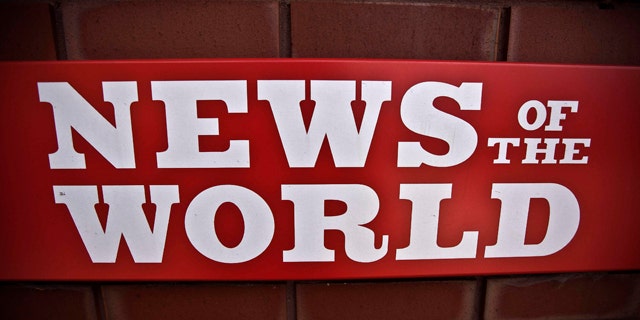 July 6: News of the World sign is seen by an entrance at premises of News International in London.