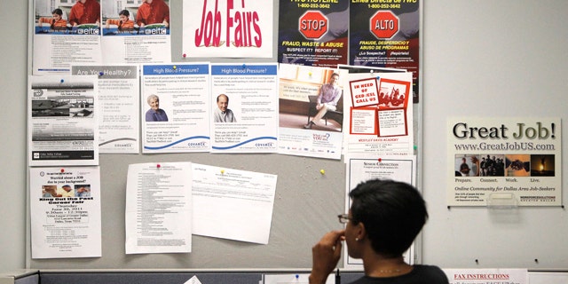 July 5: A job seeker looks at a bulletin at the Texas Workforce Commission's Workforce Solutions of Greater Dallas job resource center in Richardson, Texas.