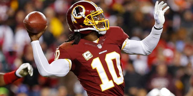 Nov 25, 2013; Landover, MD, USA; Washington Redskins quarterback Robert Griffin III (10) throws the ball against the San Francisco 49ers at FedEx Field. Mandatory Credit: Geoff Burke-USA TODAY Sports