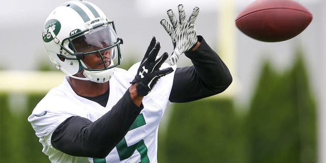 May 27, 2015; East Rutherford, NJ, USA; New York Jets wide receiver Brandon Marshall (15) catches a pass during organized team activities at Atlantic Health Jets Training Center. Mandatory Credit: Ed Mulholland-USA TODAY Sports