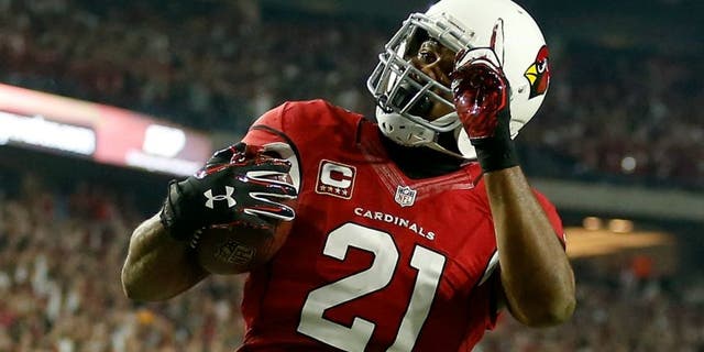 in the NFC Divisional Playoff Game at University of Phoenix Stadium on January 16, 2016 in Glendale, Arizona.,GLENDALE, AZ - JANUARY 16: Cornerback Patrick Peterson #21 of the Arizona Cardinals celebrates as he runs an interception for a touchdown back during the first half of the NFC Divisional Playoff Game against the Green Bay Packers at University of Phoenix Stadium on January 16, 2016 in Glendale, Arizona. The play was called back on a penalty. (Photo by Christian Petersen/Getty Images)