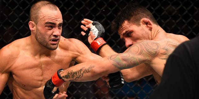 LAS VEGAS, NV - JULY 07: (L-R) Eddie Alvarez connects with a left against Rafael Dos Anjos of Brazil in their lightweight championship bout during the UFC Fight Night event inside the MGM Grand Garden Arena on July 7, 2016 in Las Vegas, Nevada. (Photo by Jeff Bottari/Zuffa LLC/Zuffa LLC via Getty Images)