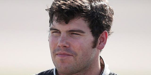 KANSAS CITY, KS - MAY 06: John Wes Townley, driver of the #05 Jive Communications Chevrolet, looks on after qualifying for the NASCAR Camping World Truck Series Toyota Tundra 250 at Kansas Speedway on May 6, 2016 in Kansas City, Kansas. (Photo by Sean Gardner/NASCAR via Getty Images)
