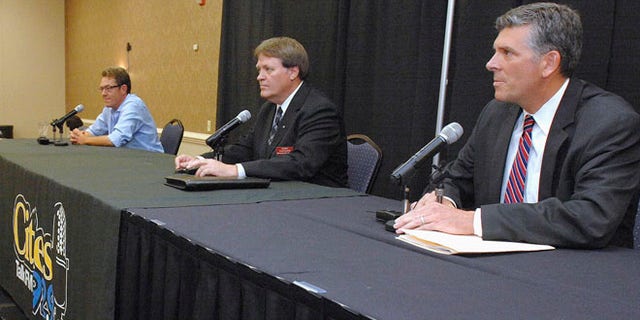 June 24, 2015: Republican candidates in a primary to fill Illinois 18th District seat from left, Michael Flynn, Donald Rients and Illinois state Sen. Darin LaHood prepare for a debate in Bloomington, Ill.