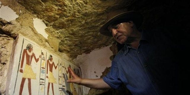 July 8: Egyptian Antiquities chief Zahi Hawass shows a false door to an unearthed 4,300-year-old tomb that belongs to Khonsu, the son of Shendwas. Both served as heads of the royal scribes during the Old Kingdom, in Saqqara near Cairo, Egypt.