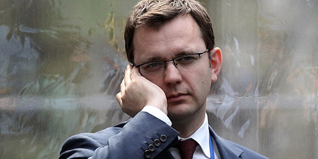 Andy Coulson, formerly editor of the tabloid News of the World, and later David Cameron's director of communications, speaks on a mobile phone in London, in this April 13, 2010, file photo.