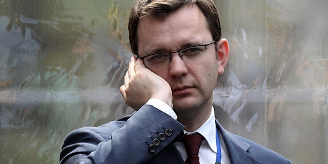 Andy Coulson, formerly editor of the tabloid News of the World, and later David Cameron's director of communications, speaks on a mobile phone in London, in this April 13, 2010, file photo.