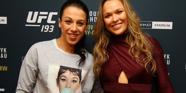 NEW YORK, NY - OCTOBER 06: (R-L) UFC women's bantamweight champion Ronda Rousey and UFC women's strawweight champion Joanna Jedrzejczyk pose for a photo at the London NYC hotel ahead of UFC 193 on October 6, 2015 in New York, United States. (Photo by Mike Stobe/Zuffa LLC/Zuffa LLC via Getty Images)