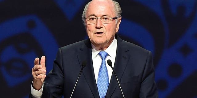 SAINT PETERSBURG, RUSSIA - JULY 25: FIFA President Joseph S. Blatter speaks as Vladimir Putin, President of Russia looks on during the Preliminary Draw of the 2018 FIFA World Cup in Russia at The Konstantin Palace on July 25, 2015 in Saint Petersburg, Russia. (Photo by Shaun Botterill/Getty Images)