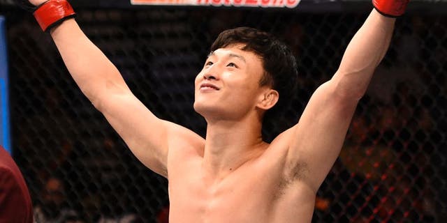 LAS VEGAS, NV - JULY 08: Doo Ho Choi of South Korea celebrates after his knockout victory over Thiago Tavares of Brazil in their featherweight bout during The Ultimate Fighter Finale event at MGM Grand Garden Arena on July 8, 2016 in Las Vegas, Nevada. (Photo by Jeff Bottari/Zuffa LLC/Zuffa LLC via Getty Images)