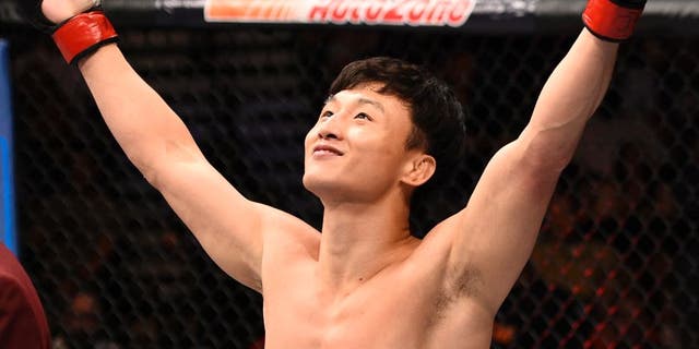 LAS VEGAS, NV - JULY 08: Doo Ho Choi of South Korea celebrates after his knockout victory over Thiago Tavares of Brazil in their featherweight bout during The Ultimate Fighter Finale event at MGM Grand Garden Arena on July 8, 2016 in Las Vegas, Nevada. (Photo by Jeff Bottari/Zuffa LLC/Zuffa LLC via Getty Images)