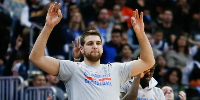 Jan 19, 2016; Denver, CO, USA; Oklahoma City Thunder forward Mitch McGary (33) reacts to a play from the bench in the fourth quarter against the Denver Nuggets at the Pepsi Center. Mandatory Credit: Isaiah J. Downing-USA TODAY Sports