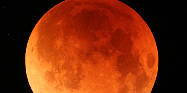 A view of the lunar eclipse from Japan's northernmost main island of Hokkaido on Aug. 28, 2007. The Earth's shadow crept across the moon's surface slowly eclipsing it and turning it to shades of orange and red during second total lunar eclipse this year.