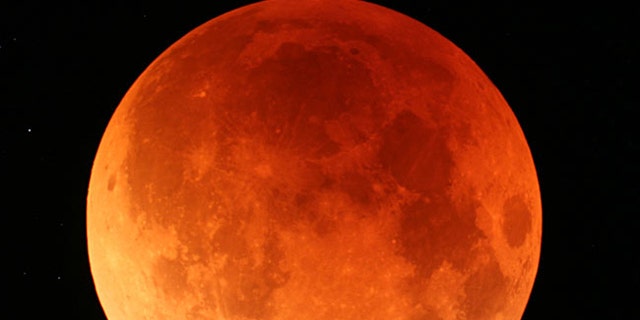 A view of the lunar eclipse from Japan's northernmost main island of Hokkaido on Aug. 28, 2007. The Earth's shadow crept across the moon's surface slowly eclipsing it and turning it to shades of orange and red during second total lunar eclipse this year.